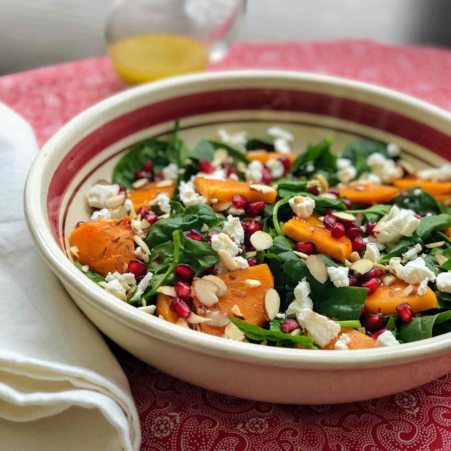 Recipe Spinach and Persimmon Salad with Goat Cheese and Pomegranate 7247725-7c1573284faa4aa98da9e056505b92ce